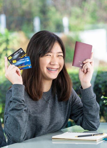 Premium Photo Portrait Of Smiling Young Woman Using Mobile Phone