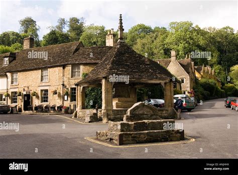 Uk Wiltshire Castle Combe Village Market Place Butter Cross Castle Inn