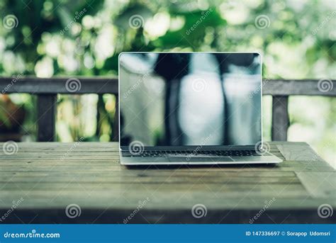 Laptop Computer Mockup Has Empty Screen Outside On Table Stock Image