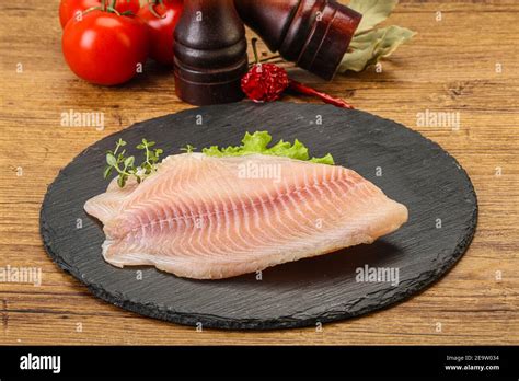 Raw Tilapia Fish Fillet For Cooking Stock Photo Alamy