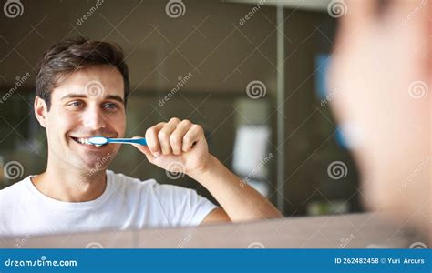 Keeping His Teeth Clean And Healthy Closeup Of A Young Man Brushing