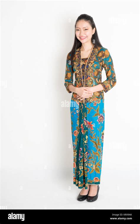 Southeast Asian woman in batik dress Stock Photo - Alamy