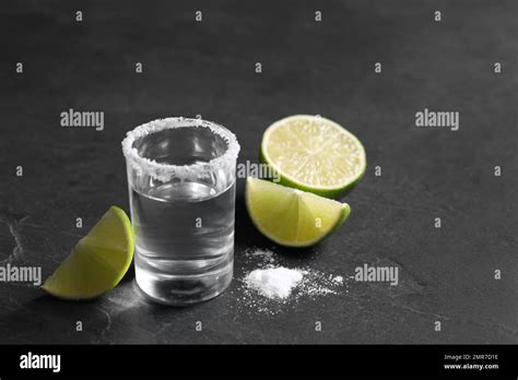 Mexican Tequila Shot Lime Slices And Salt On Grey Table Stock Photo