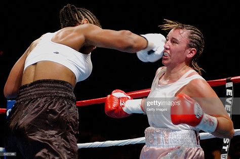 Laila Ali lands a punch on Christy Martin on August 23, 2003 at the ...