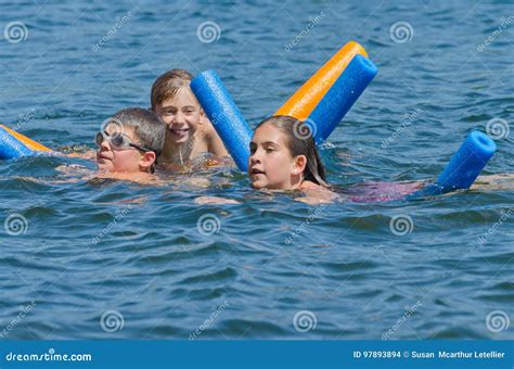 Kids Having Summer Fun Swimming in Lake Stock Photo - Image of jump, happy: 97893894