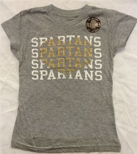 Myu Girls Tee In Heather Grey Spartans Repeating With Metallic Gold