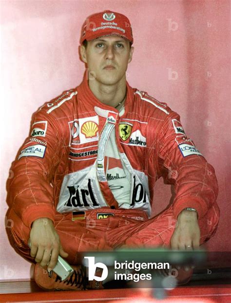 Image Of Ferrari Driver Michael Schumacher Of Germany Sits On The Bench