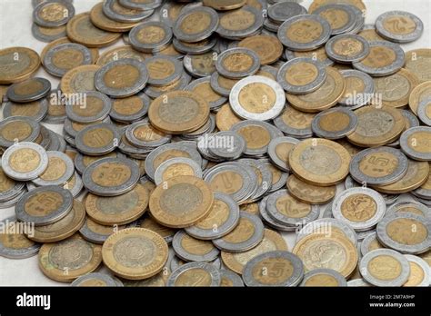 group of mexican peso coins of various denominations, with copy space ...