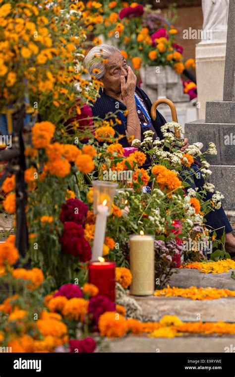 An Elderly Woman Reflects At The Gravesite Of Her Deceased Husband