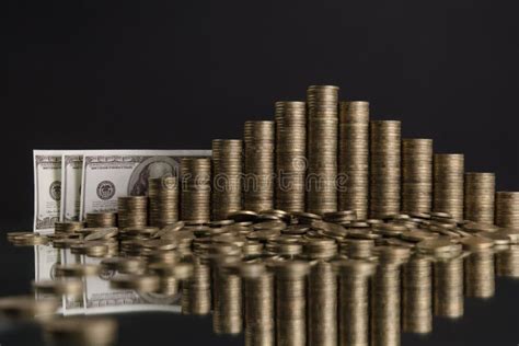 Photo Of Piles Of Coins In The Shape Of A Pyramid On The Grey