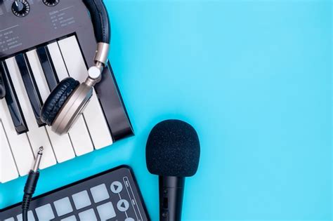 Premium Photo | Music recording equipment on blue copy space