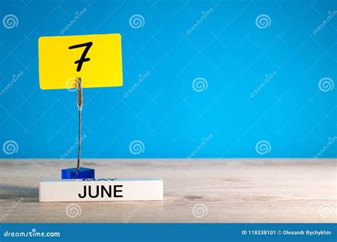 June 7th Day 7 Of June Month Calendar On Table With Blue Background