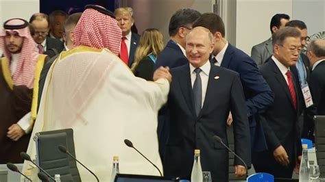 Saudi Arabia S Crown Prince And Vladimir Putin Laugh And Clasp Hands At G 20 Summit