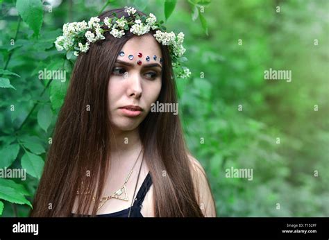 A Forest Picture Of A Beautiful Young Brunette Of European Appearance