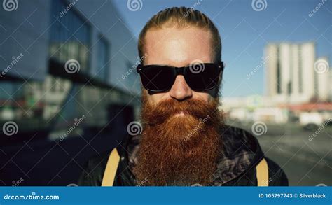 Closeup Portrait Of Young Bearded Hipster Man In Sunglasses Smiling And