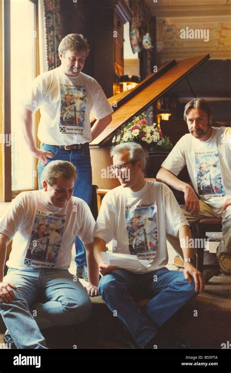 Lindisfarne band members Ray Laidlaw centre and Alan Hull wearing Swan Hunter campaign t shirts ...