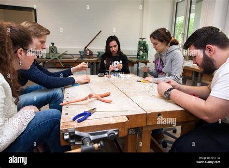 Students in art class create a work of art Stock Photo - Alamy