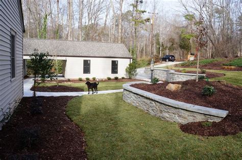 REAL ROCK RETAINING WALL ... The front yard at this home sloped towards ...