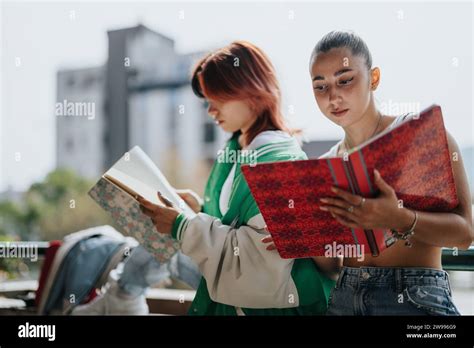 Two High School Girls Studying Outdoors In The City They Are