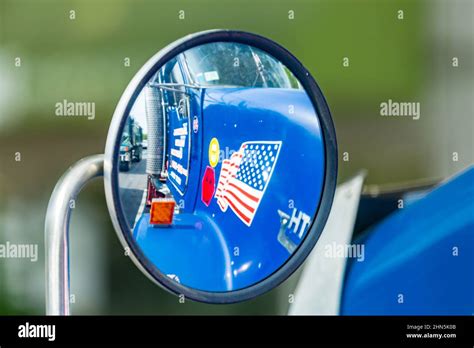 American flag decal and other decals in a convex mirror on a semi truck ...