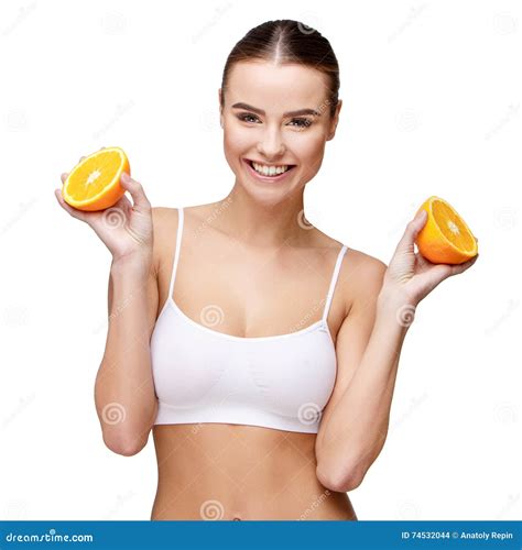 Portrait Of Attractivesmiling Woman Holding Orange Isolated On White