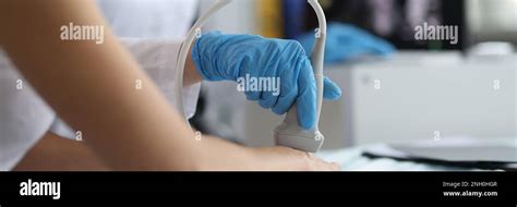 Doctor makes ultrasound of wrist in clinic closeup Stock Photo - Alamy