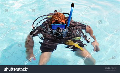 Happy Scuba Diver In The Swimming Pool Blowing Bubbles Stock Photo