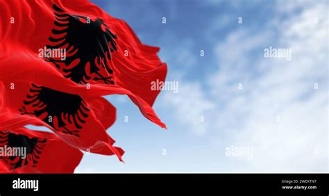 Albanian National Flags Waving In The Wind On A Clear Day Red Flag