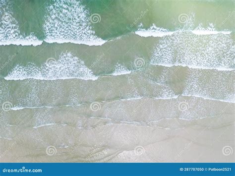 Beach On Aerial Drone Top View With Ocean Waves Reaching Shore Stock