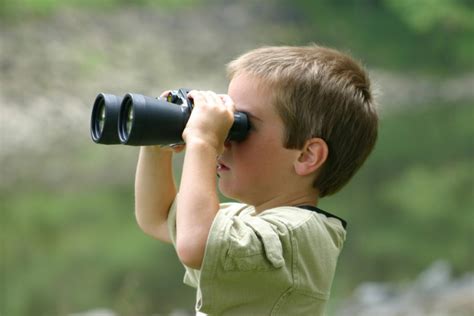 Boy Looking Through Binoculars Kendalwood Montessori Elementary