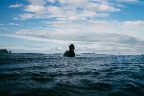 Person Floating In Ocean Photo By Tim Marshall Timmarshall On Unsplash