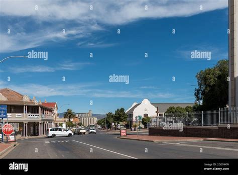 CALEDON, SOUTH AFRICA - APRIL 12, 2021: A street scene, with buildings and vehicles, in Caledon ...