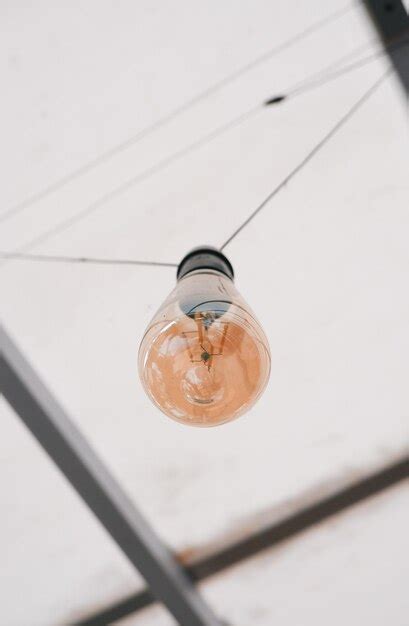 Premium Photo | Hanging light bulb