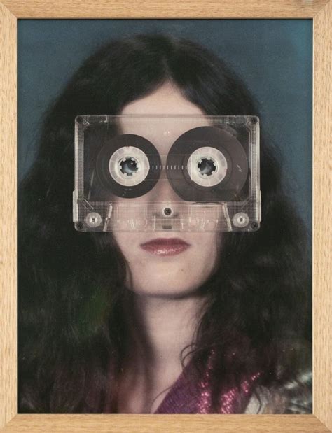 A Woman With Long Black Hair Wearing A Cassette