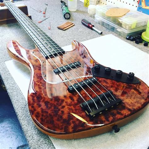 An Electric Bass Guitar Sitting On Top Of A Counter