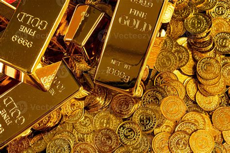 Gold bars are placed on a pile of gold coins 26334406 Stock Photo at