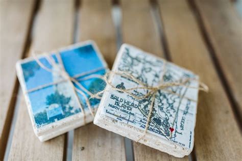 Two Square Coasters Tied With Twine On Top Of A Wooden Table One Is