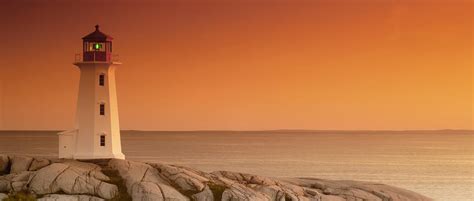 Sunset At Peggys Cove Lighthouse Photograph By Norman Pogson