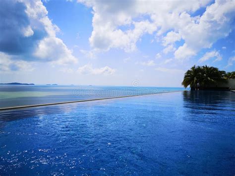 Infinity Pool and Ocean with Blue Sky and White Clouds Stock Photo ...