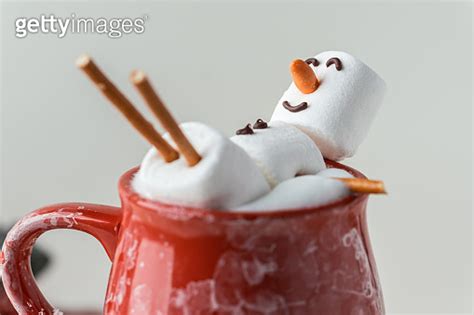 Marshmallow Snowman Taking Hot Tub In A Red Ceramic Cup Full Of Cocoa With Milk Foam Christmas