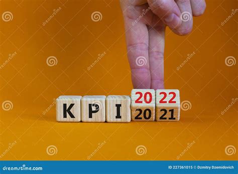 Kpi Key Performance Indicator Symbol Businessman Turns Wooden Cubes