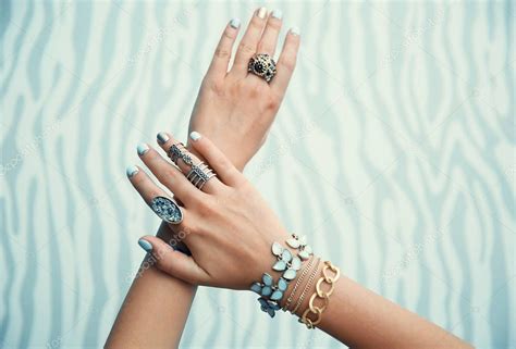 Female hands with jewelry — Stock Photo © belchonock #130399068