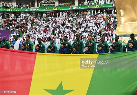 Senegal players stand for the national anthem prior to the FIFA World ...