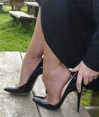 Blonde Hottie Posing Outdoors In Stiletto Heels Photos