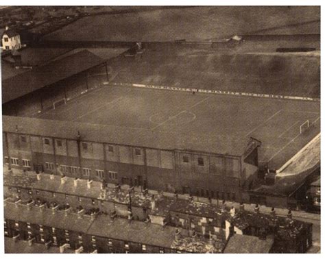 An Aerial View Of A Soccer Field In The Middle Of Town Taken From Above