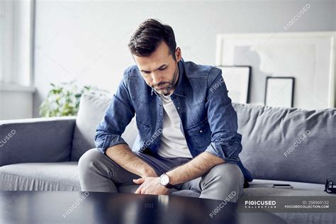 Man Sitting On Couch Man Sitting On Couch Hd Stock Images