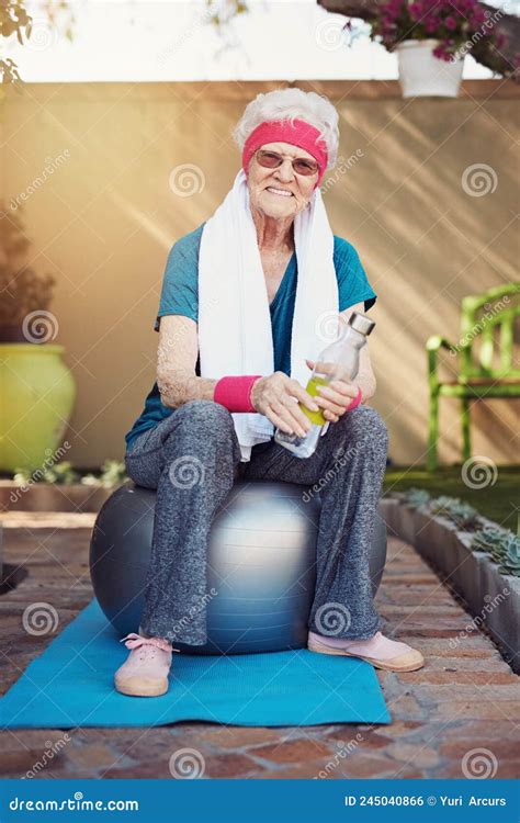 Maintaining An Active Lifestyle Shot Of A Senior Woman Exercising At