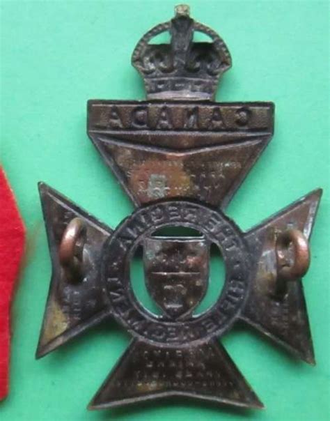 The Regina Rifle Regiment Canadian Cap Badge In Helmet And Cap Badges