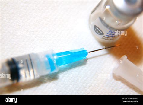 Hypodermic needle in use Stock Photo - Alamy