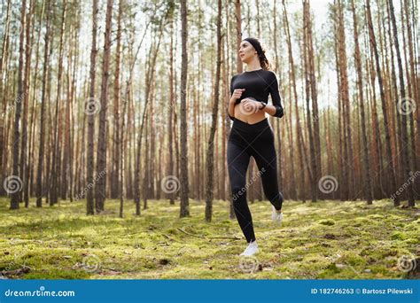 Teenager Running In The Woods Pretty Young Girl Runner In The Forest